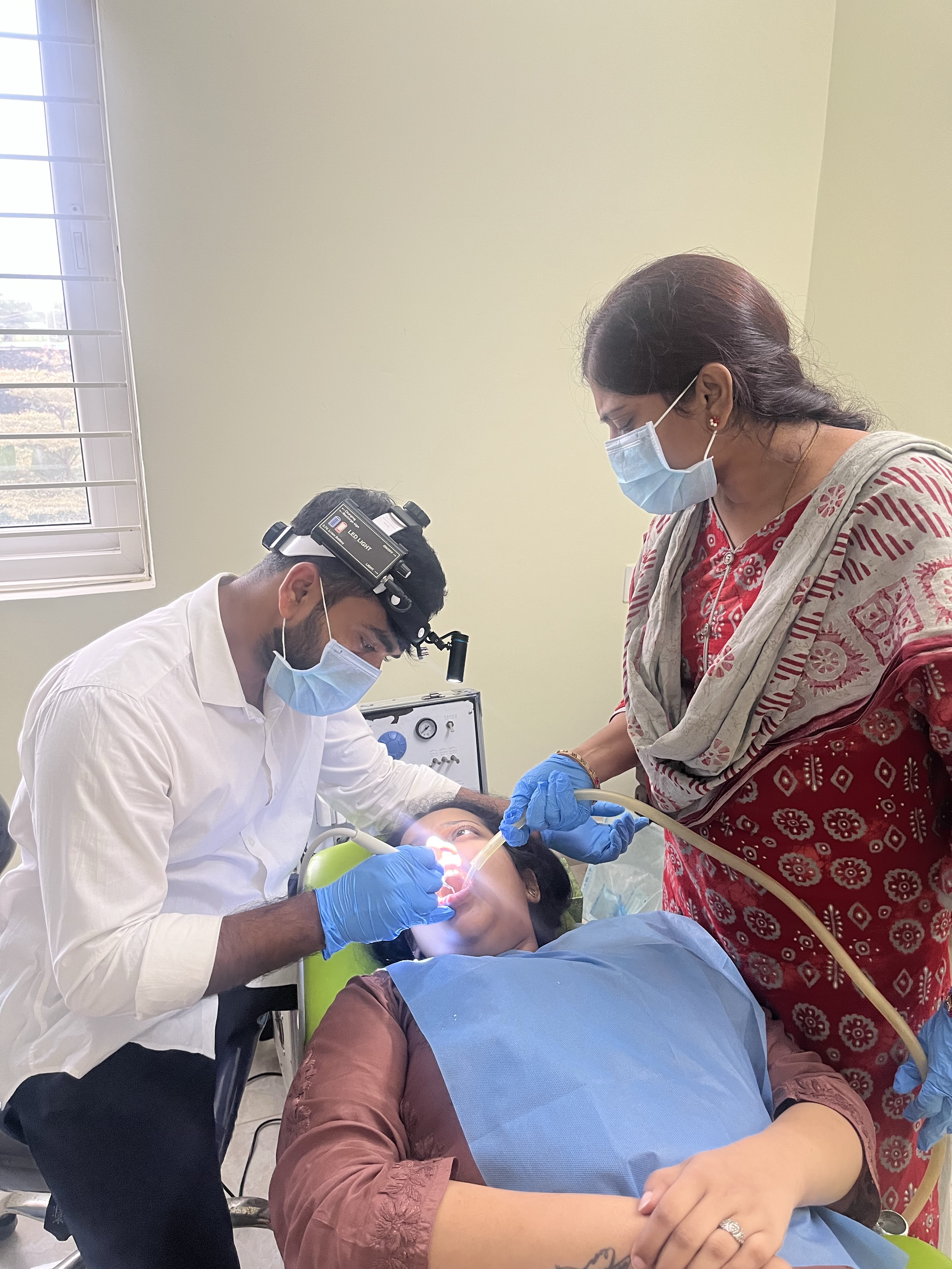 Prudentoe dentist performing dental treatment at a patient's home in Hyderabad
