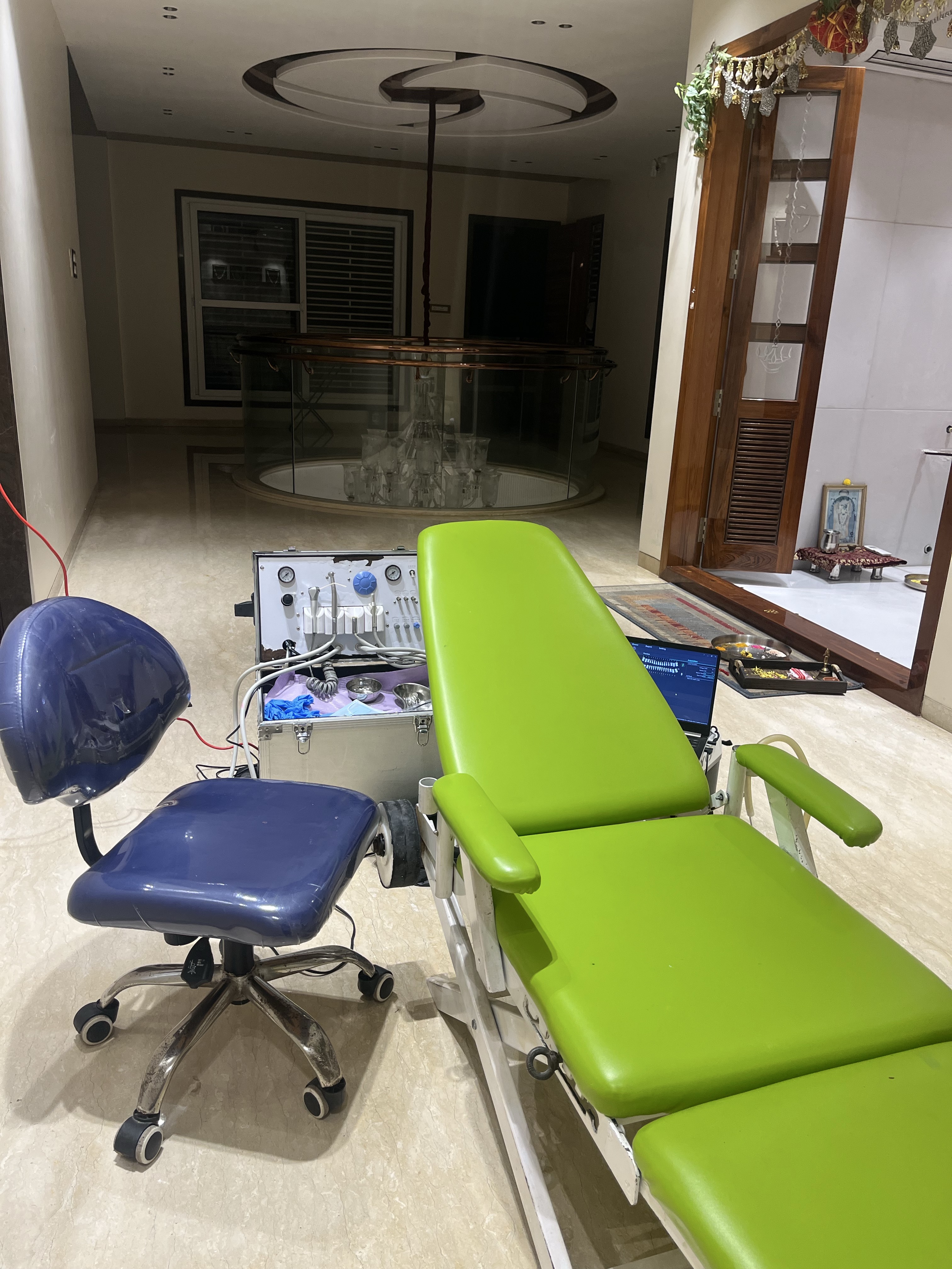 Prudentoe portable dental chair and equipment case set up inside a patient's home in Hyderabad